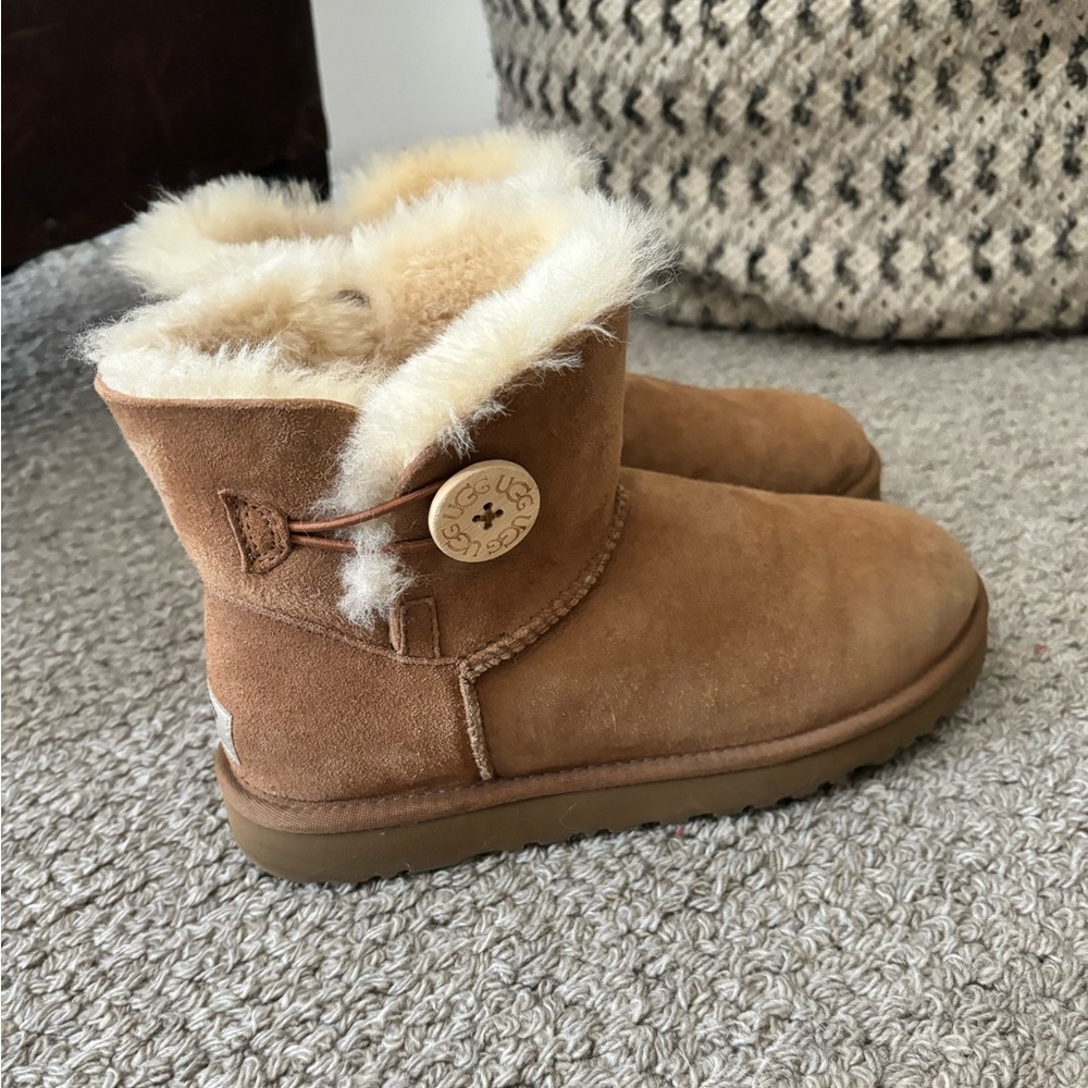 UGG booties with a button